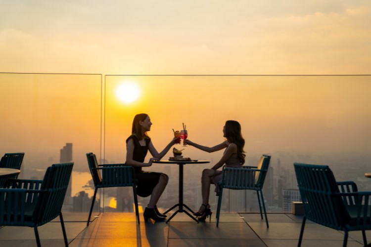 Two women on the rooftop bar
