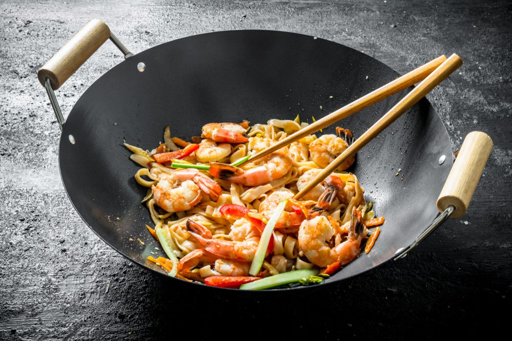 a wok with shrimps
