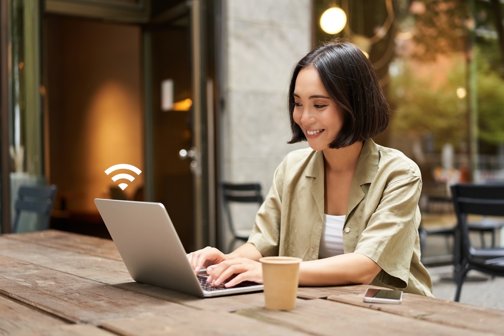 a woman is working on laptop